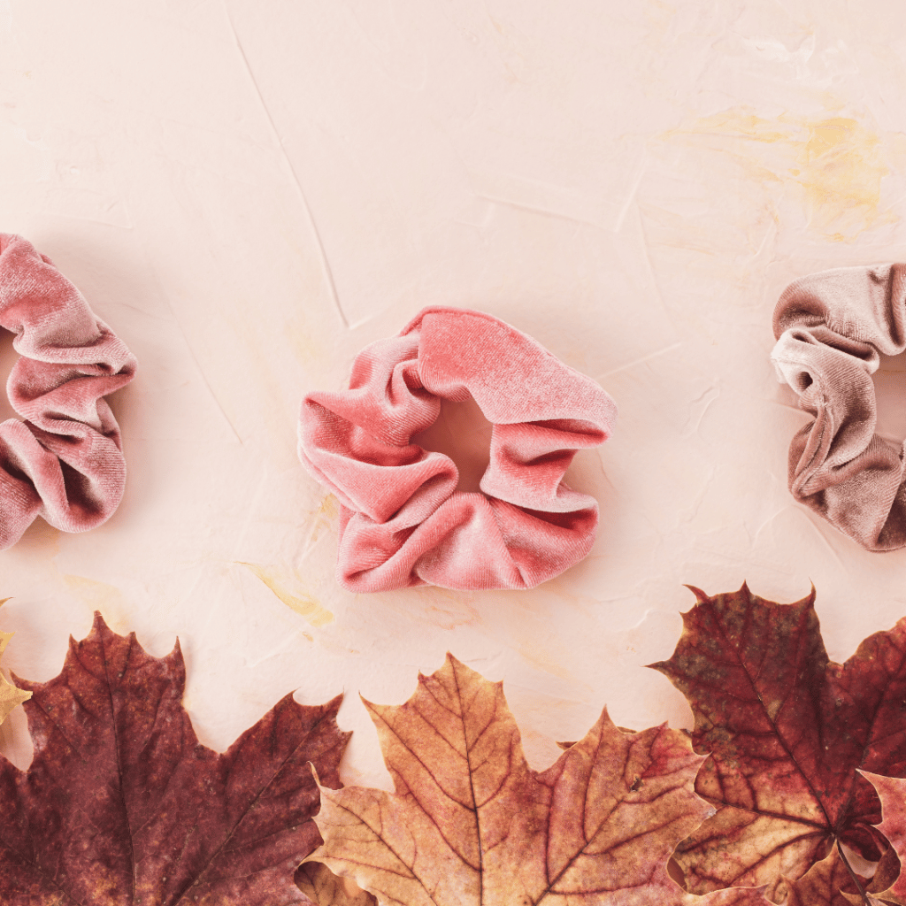 Scrunchies on a layout and fall leaves on the bottom.